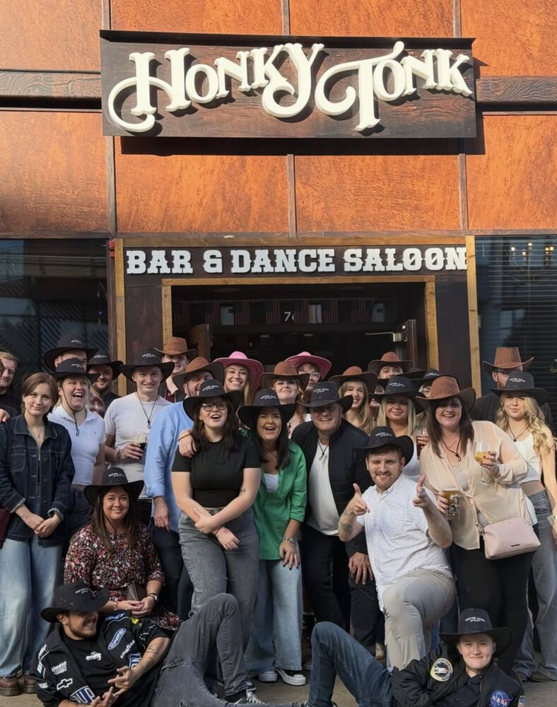 A large group of customers wearing Sonison cowboy hats outside Cactus Jack's Honky Tonk in Sheffield