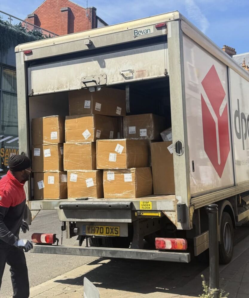 Boxes of Sonison hats loaded into a DPD delivery truck, going out to a UK venue